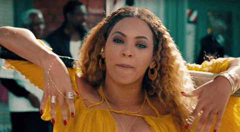 Beyoncé in yellow dress from Lemonade visual album.